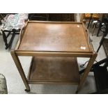 A VINTAGE COLLAPSABLE TWO TIER TEA TROLLEY