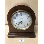 A MAHOGANY CASED MANTLE CLOCK BY SETH THOMAS, THE ENAMEL DIAL WITH ARABIC NUMERALS DENOTING HOURS,
