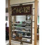 AN ORIENTAL BEVELLED EDGED MIRROR IN A BAMBOO STYLE FRAME 39 X 62 CM