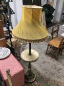 A VINTAGE BRASS AND ONXY STANDARD LAMP