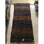 A VINTAGE RUG 146 X 52CMS