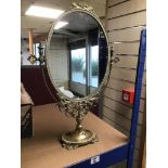 A LARGE ORNATE BRASS SWING MIRROR 55 CM