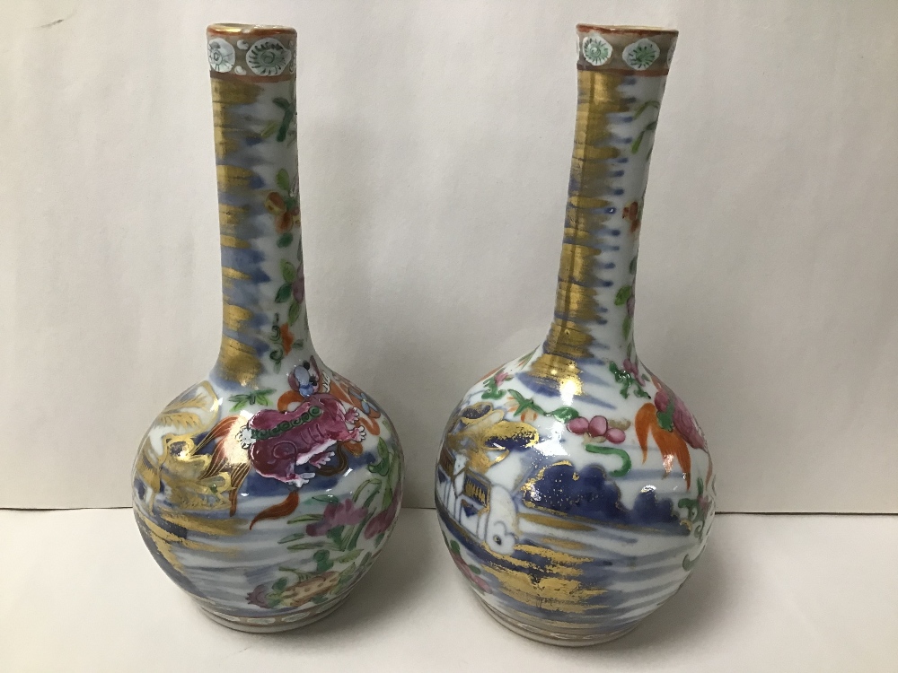 TWO SIMILAR EARLY CHINESE PORCELAIN FAMILLE ROSE BOTTLE VASES, HIGHLY DECORATED THROUGHOUT, 16.5CM - Image 2 of 2