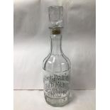 A LARGE GLASS DECANTER (JACK DANIELS GOLD MEDAL OLD NO7)