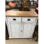 A VINTAGE PAINTED PINE CUPBOARD WITH TWO DRAWERS