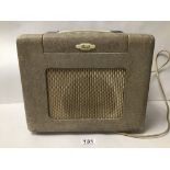 A VINTAGE BUSH RADIO, GIVEN IN RECOGNITION OF 25 YEARS SERVICE WITH A COMPANY WITHIN THE RANK