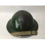 A 1939 IRISH WARDENS HELMET WITH RAF UNIFORM CLOTH BADGES