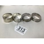 FOUR SILVER NAPKIN RINGS WITH ENGINE TURNED DECORATION, 59G