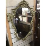 AN ORNATE GILDED MIRROR 74 X 53CMS