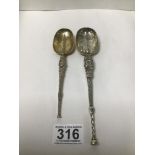 TWO HEAVY SILVER COPIES OF THE CORONATION SPOON, ONE BEING HALLMARKED LONDON 1910 BY GARRARD & CO,