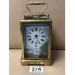 A LARGE BRASS REPEATER CARRIAGE CLOCK WITH DETAILED ENAMEL PANELS TO FRONT AND SIDES, THE DIAL
