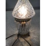 A CRYSTAL DROP SIDE LIGHT WITH ORNATE BRASS WORK