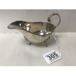 A GEORGE V SILVER SAUCE BOAT, RAISED UPON THREE HOOF FEET, HALLMARKED BIRMINGHAM 1919 BY WILLIAM