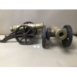 TWO HEAVY METAL CANNONS ON CAST WHEELS, 34CM LONG