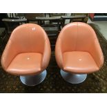 A PAIR OF LEATHERETTE VINTAGE SWIVEL TUB CHAIRS ON CHROME BASES
