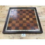 A VICTORIAN CHESS BOARD WITH DECORATIVE IVORY BORDER 37 X 39CMS