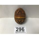 A CARVED TREEN EGG, POSSIBLY A NUT, UNSCREWING INTO TWO PARTS, 5.5CM LONG