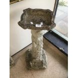 A CONCRETE BIRD BATH WITH MICE RUNNING UP THE PEDESTAL AND INSCRIBED TO THE BASE (FIND MUCH JOY IN