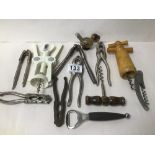 A GROUP OF VARIOUS BOTTLE OPENERS, CORKSCREWS, AND NUT CRACKERS