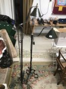 TWO WROUGHT IRON INDUSTRIAL LOOK FLOOR LAMPS