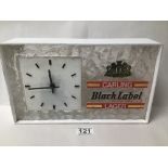 A VINTAGE CARLING BLACK LABEL LAGER WALL MOUNTED CLOCK