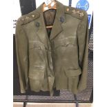 A VINTAGE MILITARY TUNIC WITH BUTTONS FROM THE CATERING CORPS