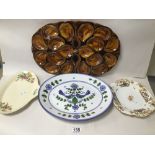 A LARGE GLAZED CERAMIC HORS D'OEUVRES DISH OF OVAL FORM, 45CM WIDE, TOGETHER WITH THREE CERAMIC