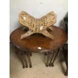 A SET OF THREE WALNUT NEST OF TABLES WITH A FOLDING BOOK STAND