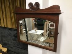 A MAHOGANY BEVELLED MIRROR