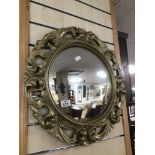 A GILDED CONVEX WALL MIRROR 52CMS DIAMETER