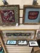A QUANTITY OF FRAMED AND GLAZED ORIENTAL SILKS AND STAMPS LARGEST 53 X 21 CM