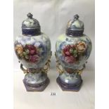 A PAIR OF VICTORIAN LIDDED VASES DECORATED WITH FOLIAGE AND ROSES 44CMS