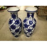 A PAIR OF LARGE BALUSTER VASES DECORATED WITH BLUE FLOWERS 60CMS