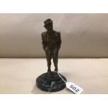 A NICKEL-SILVERED BRONZE WELL DETAILED MOUSTACHED MAN IN HAT MOUNTED ON A MARBLE BASE ( A TRAMEL