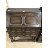 A VICTORIAN OAK BUREAU WITH TWO OAK DRAWERS