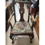 AN OAK VICTORIAN ARM CHAIR