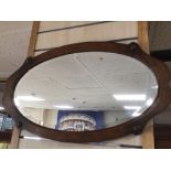 AN OAK FRAMED BEVELLED MIRROR 68 X 40CM