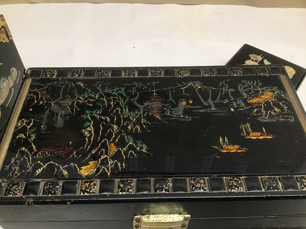 THREE BLACK LACQUERED JEWELLERY BOXES WITH MOTHER IN PEARL AND DECORATED WITH ANIMALS AND RIVER - Image 8 of 9