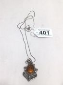 A SILVER NECKLACE 925 WITH A 925 SILVER AND AMBER PENDANT BY SUARTI
