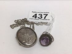 AN AMETHYST AND MARCASITE OVAL CLUSTER SILVER RING SIZE G WITH A 925 SILVER LOCKET AND CHAIN