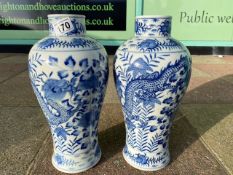 A LARGE PAIR OF BLUE AND WHITE CHINESE PORCELAIN VASES DECORATED WITH CHASING DRAGONS CHARACTER