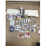 A WII WITH ACCESSORIES AND GAMES, FIFA II, TOY STORY, MARIO, SONIC AND MORE