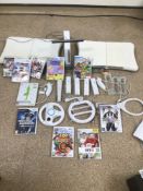 A WII WITH ACCESSORIES AND GAMES, FIFA II, TOY STORY, MARIO, SONIC AND MORE
