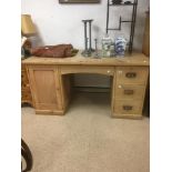 A VICTORIAN PERIOD PINE KNEE-HOLE DESK WITH THREE DRAWERS AND CUPBOARD (ONE PIECE)