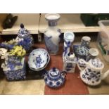 A LARGE QUANTITY OF BLUE AND WHITE CHINA INCLUDES VASES TEAPOT AND GLASS FLOWERS