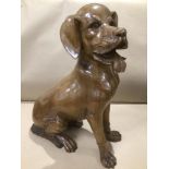 A LARGE WOODEN CARVED DOG 52CMS