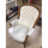 A CREAM LEATHER BUTTON BACK ARM CHAIR A/F