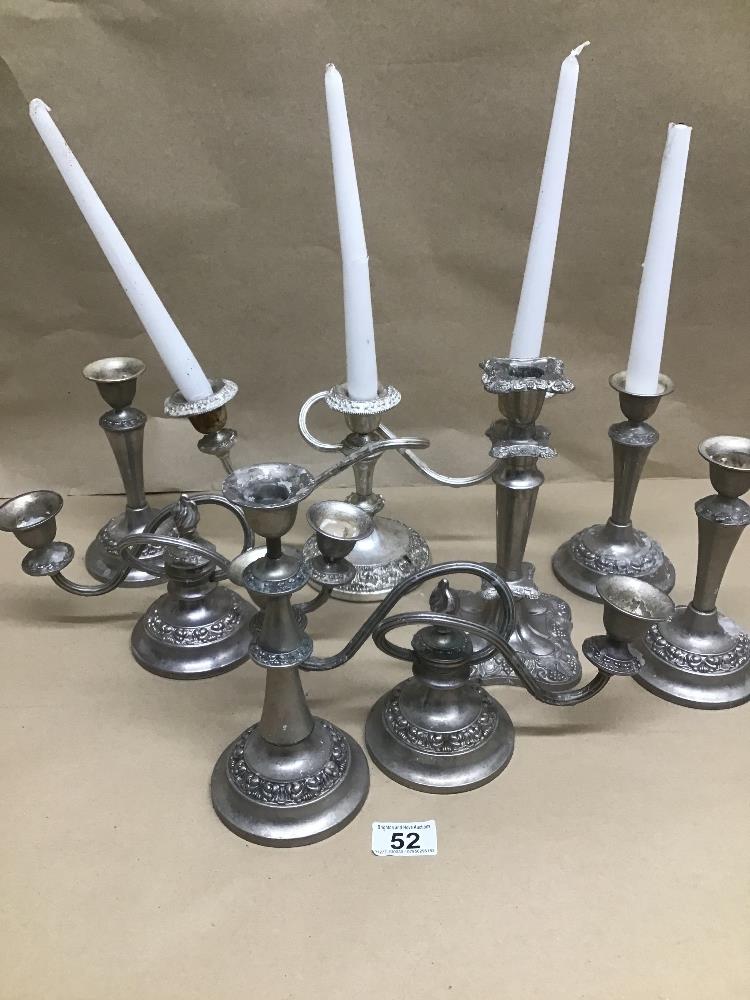 A QUANTITY OF PLATED CANDLESTICKS AND CANDELABRAS