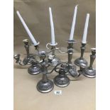 A QUANTITY OF PLATED CANDLESTICKS AND CANDELABRAS