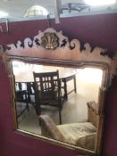 A GEORGIAN WALL MIRROR WITH GILDED BORDER AND SHALL 72 X 71CM